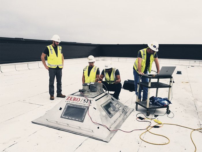 Z6 workers conducting an uplift roof test